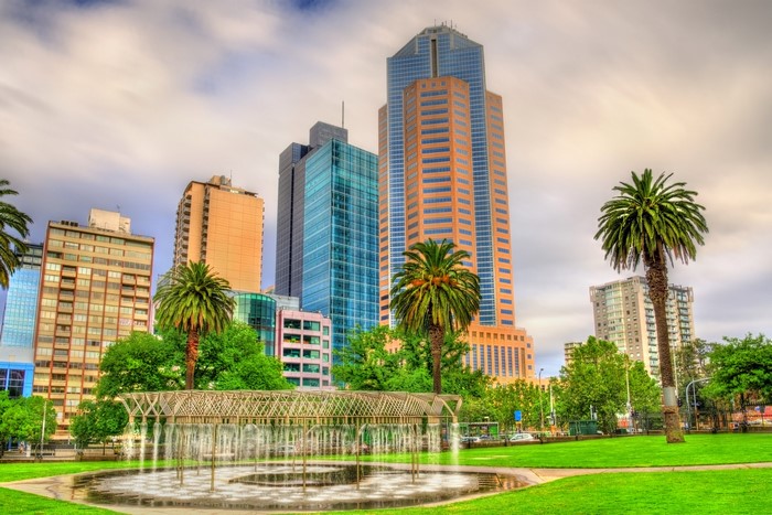 Melbourne skyscrapers and fountain in a park