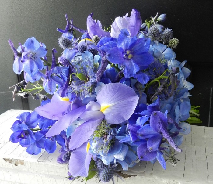 Blue and purple flower bouquet with irises and delphiniums