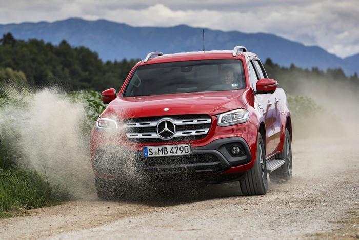 Red Mercedes-Benz X-Class Pickup Driving Through Water
