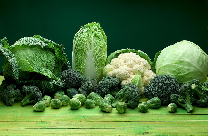 Assortment of Green Vegetables on a Wooden Table