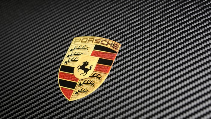 Porsche Logo Emblem on Carbon Fiber