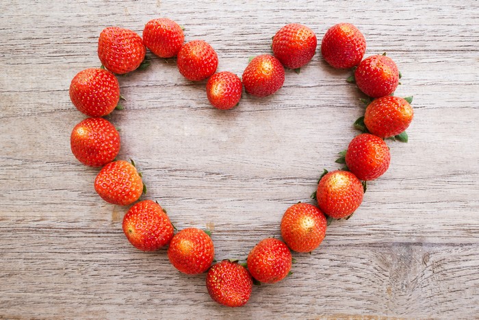 Strawberries arranged in a heart shape
