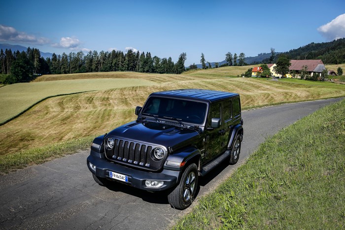 Jeep Wrangler Unlimited Sahara SUV on a country road
