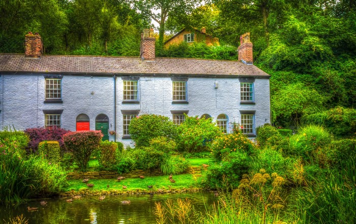 Terraced houses by a pond in Lymm, England