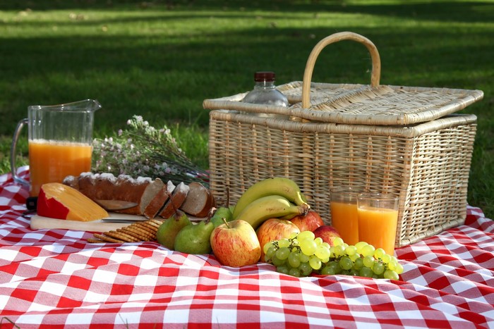 Picnic with Juice, Grapes, Apples, Cheese, Bread, Bananas, Pears in Wicker Basket