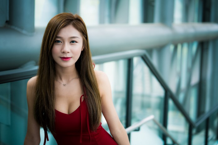 Asian woman with brown hair in a red dress