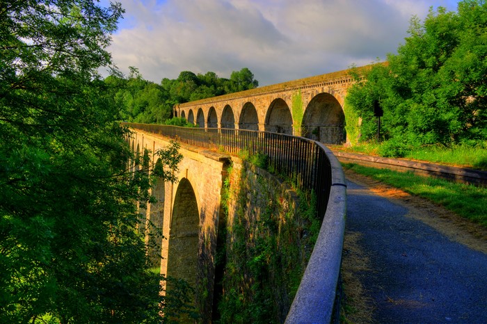Stone viaduct with arches and trees in Shropshire, England