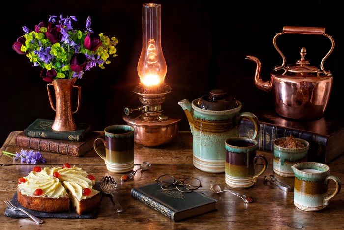 Still-life with cake, flowers, and tea set
