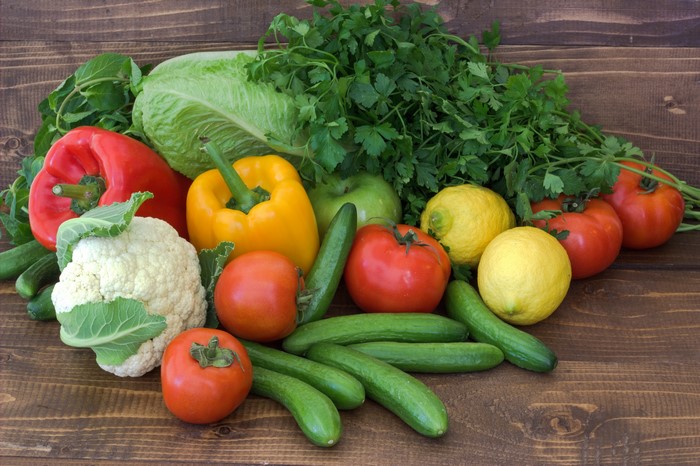 Vegetables: Bell peppers, tomatoes, cucumbers, cabbage, lemons, cauliflower, and parsley