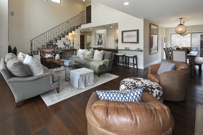 Living room with sofa, armchair, and dining area