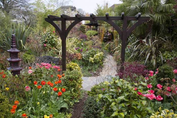 English garden with tulips and pagoda