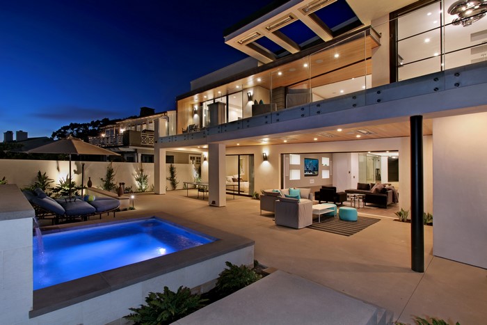 Modern Mansion with Pool and Outdoor Living Area at Dusk