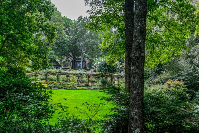 Gibbs Gardens with a house and pergola