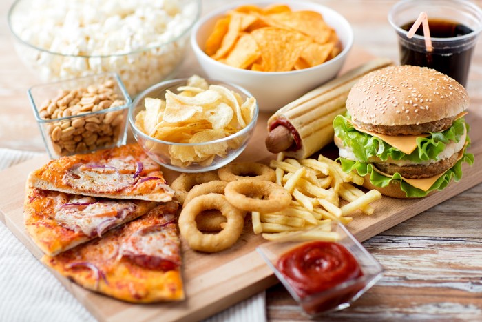 Assortment of fast food items including pizza, burger, and fries