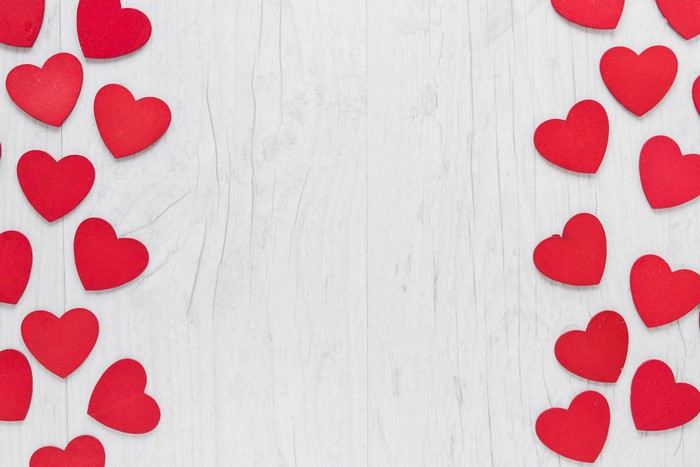 Red Hearts on White Wood Background
