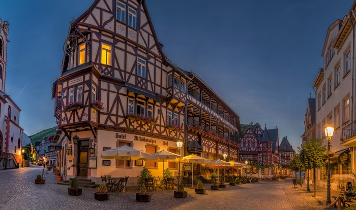 Half-timbered buildings and street lights at night in Bacharach, Germany