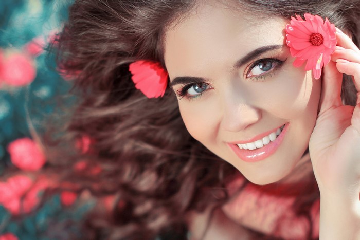 Beautiful woman with brown hair and flowers