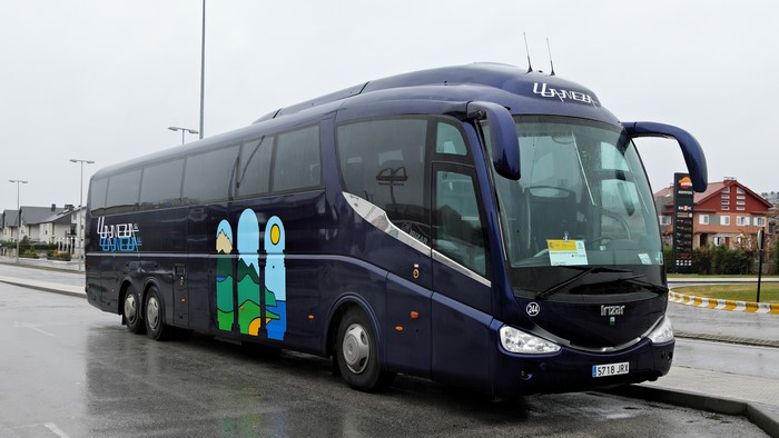 Blue Irizar PB bus with graphics