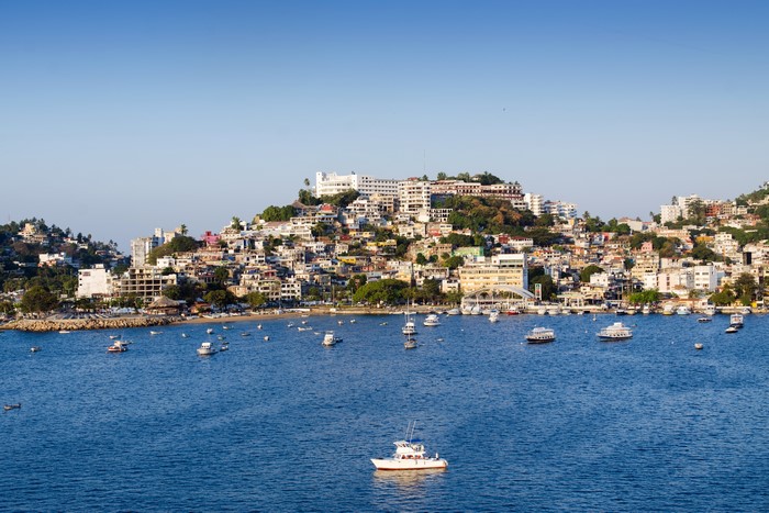 Acapulco Bay with boats and hillside homes, Mexico
