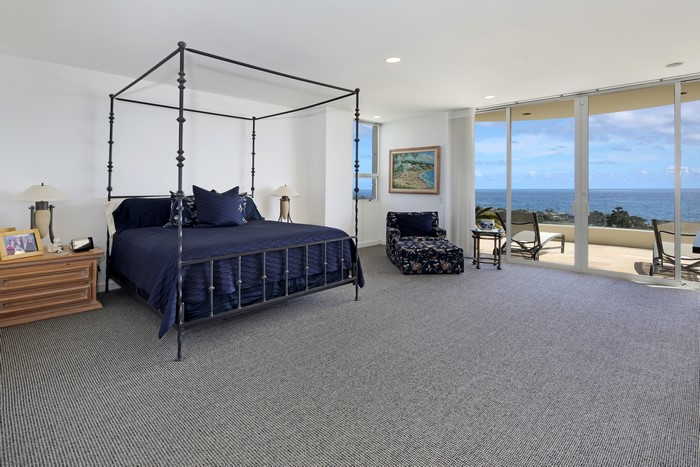 Bedroom with canopy bed and ocean view