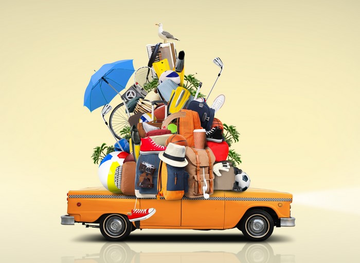 Taxi overloaded with luggage and travel items