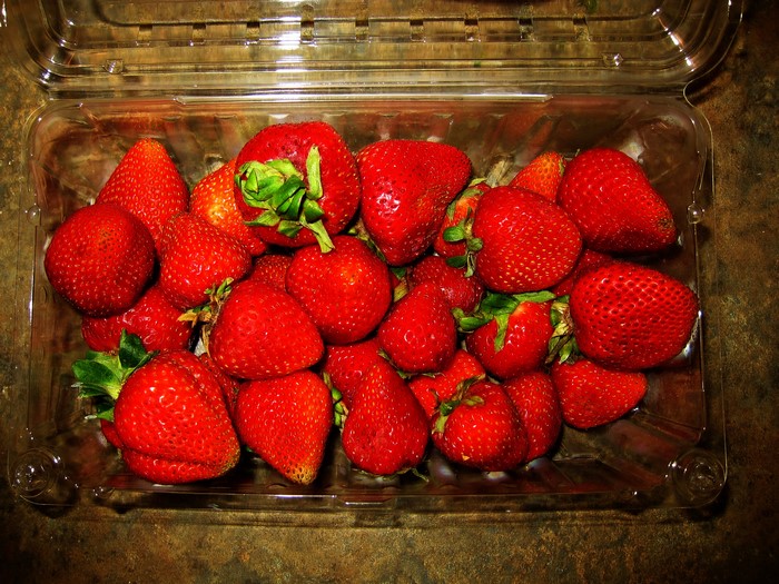 Strawberries in a clear plastic container