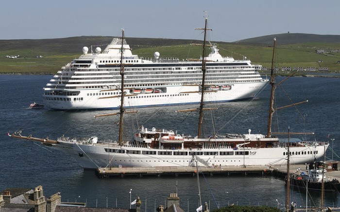 Cruise liner and sailing ship in harbor