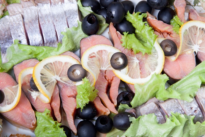 Seafood Platter with Salmon, Herring, Olives, and Lemon