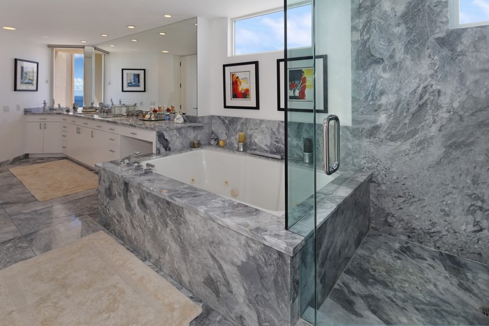 Modern marble bathroom with bathtub and shower