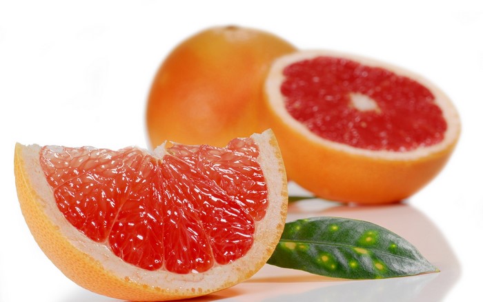 Grapefruit slice and whole grapefruit