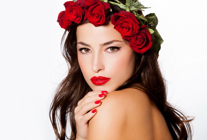 Woman with red roses and red lipstick