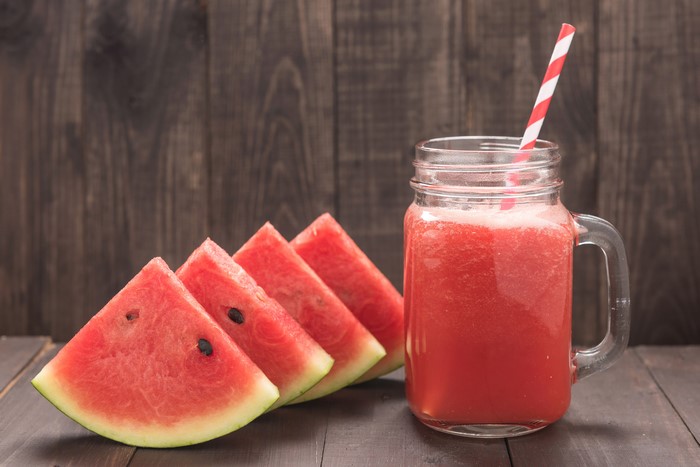 Watermelon slices and juice in a mug