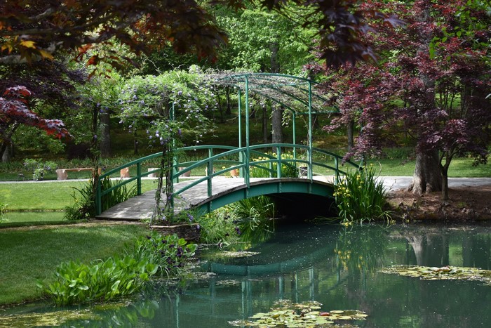 Gibbs Gardens Pond with Green Bridge and Trees