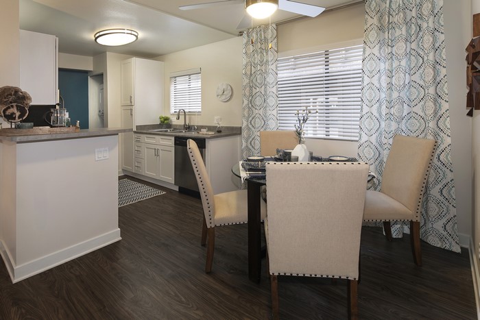 Kitchen and Dining Area with Table and Chairs