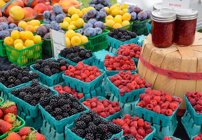 Raspberries, Blackberries, Plums, and Jam Jars at a Market