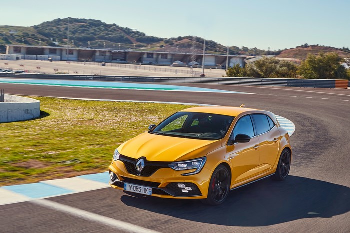 Yellow Renault Megane R.S. Cup on a race track