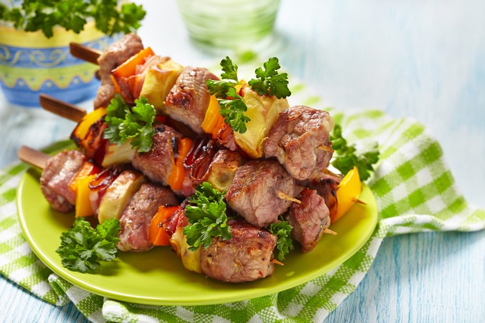 Meat and vegetable skewers on a plate