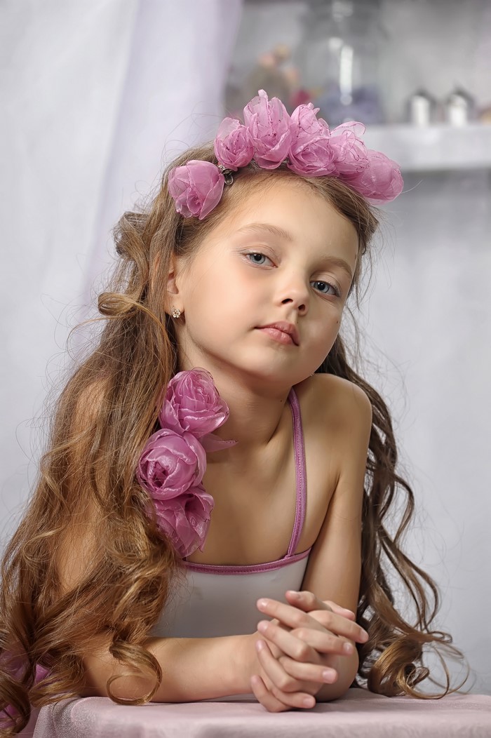Young Girl with Pink Roses and Long Brown Hair
