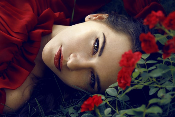 Woman in red dress with roses
