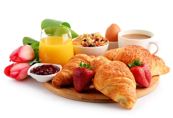 Breakfast with Croissants, Juice, and Tulips