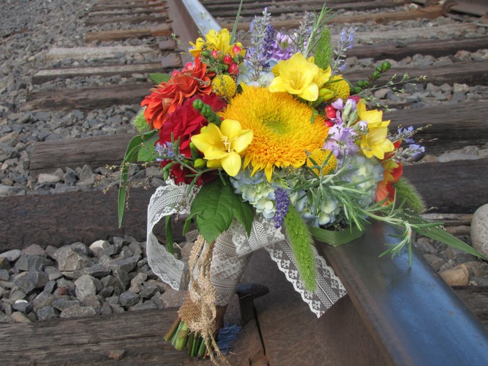 Bouquet of flowers on train tracks