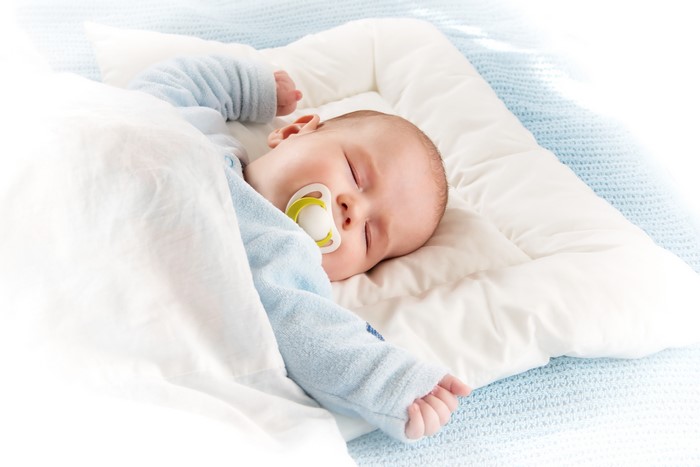 Baby sleeping with pacifier