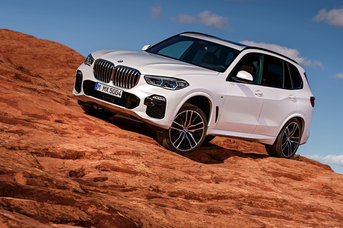 White BMW X5 xDrive30d M Sport on rocky terrain