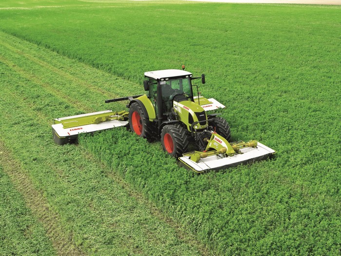Claas Arion 630C tractor mowing a field