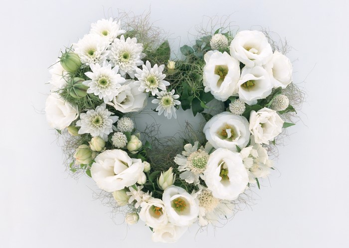 Heart-shaped floral arrangement of white Eustoma and Chrysanthemums