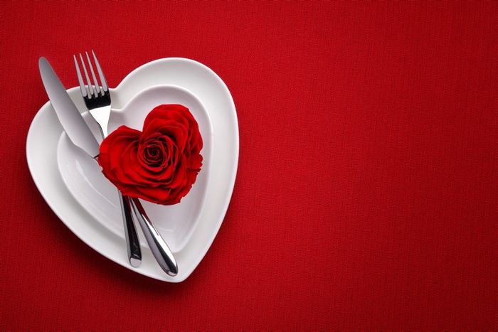 Valentine's Day heart plates with rose, knife, and fork
