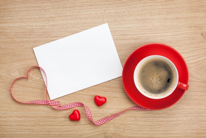 Coffee cup with ribbon heart and blank card