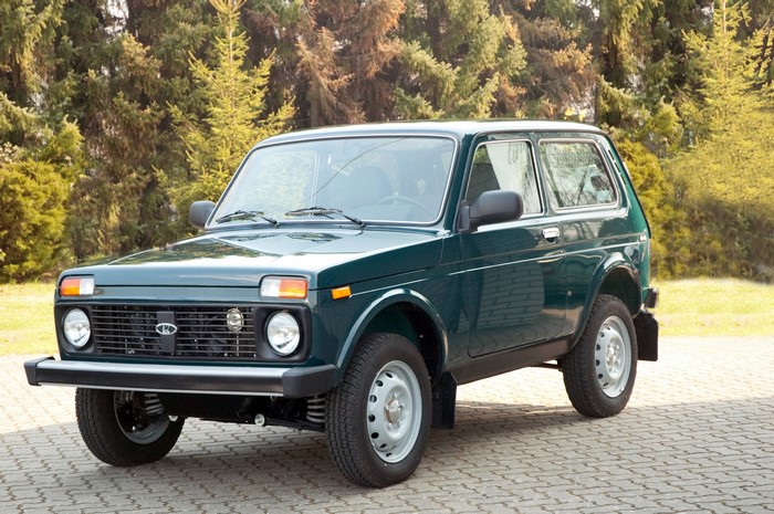 Green Lada Niva car parked on a paved surface
