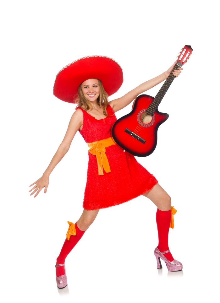 Woman in red dress and sombrero playing guitar