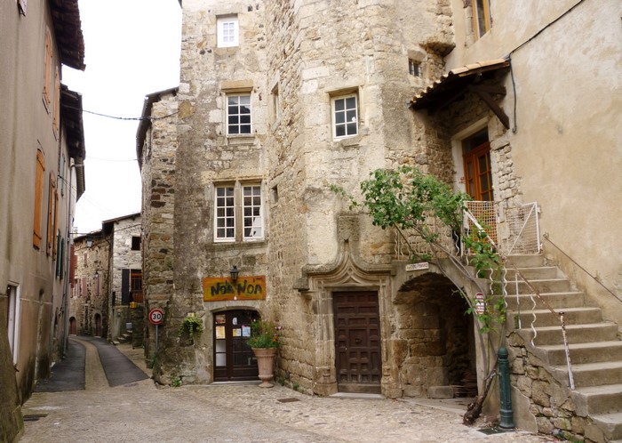 Street in Ardeche, France with stone houses and stairs